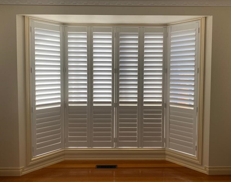 White PVC Plantation Shutters on Bay Windows